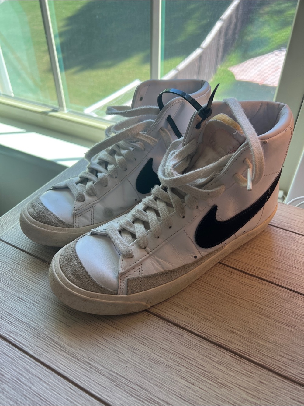Nike Women's White High-Top Sneakers with Black Swoosh and Tan Accents